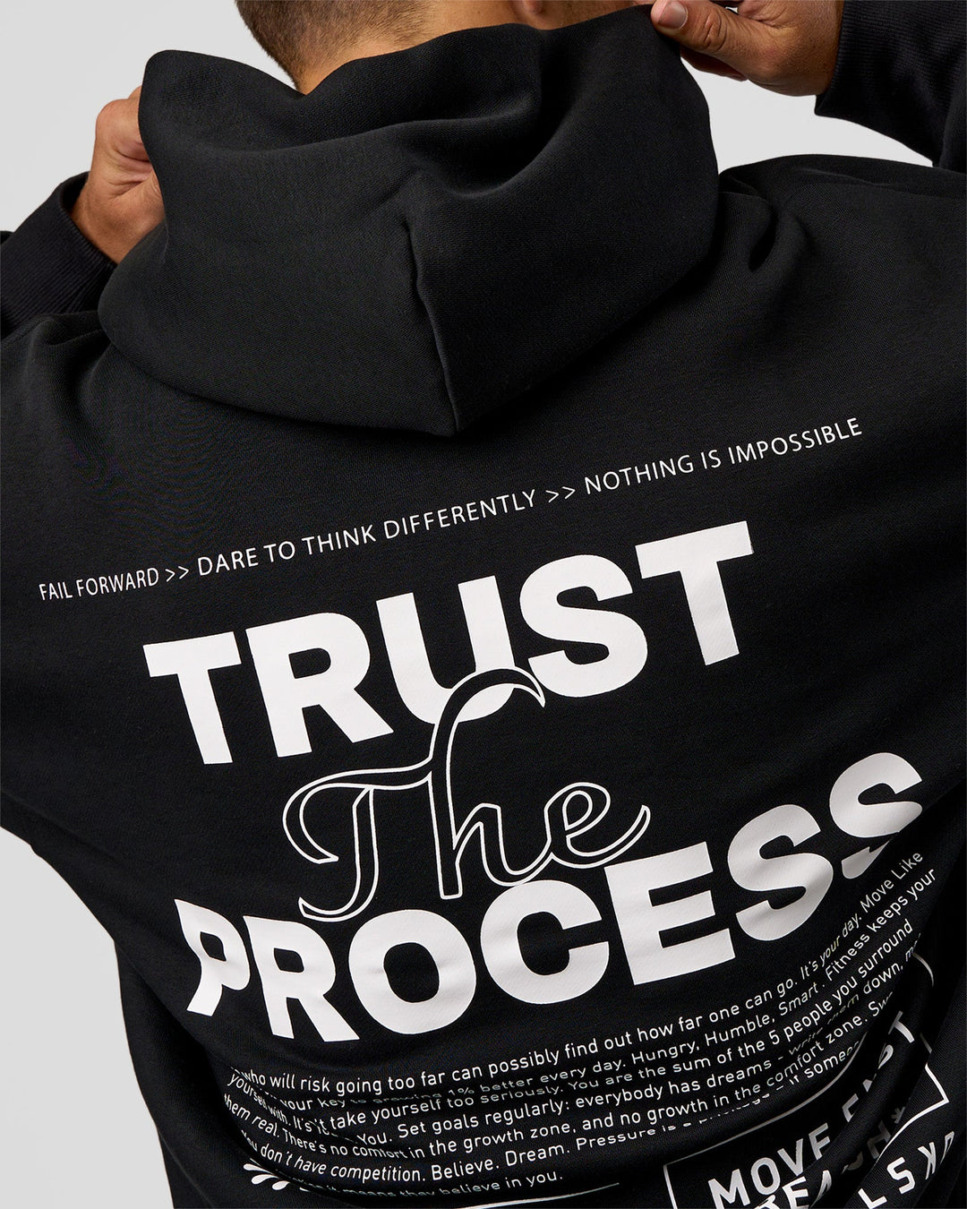 Man wearing Trust The Process Unisex Oversized Hoodie - Black-White | Model:Jaiden | Size:L