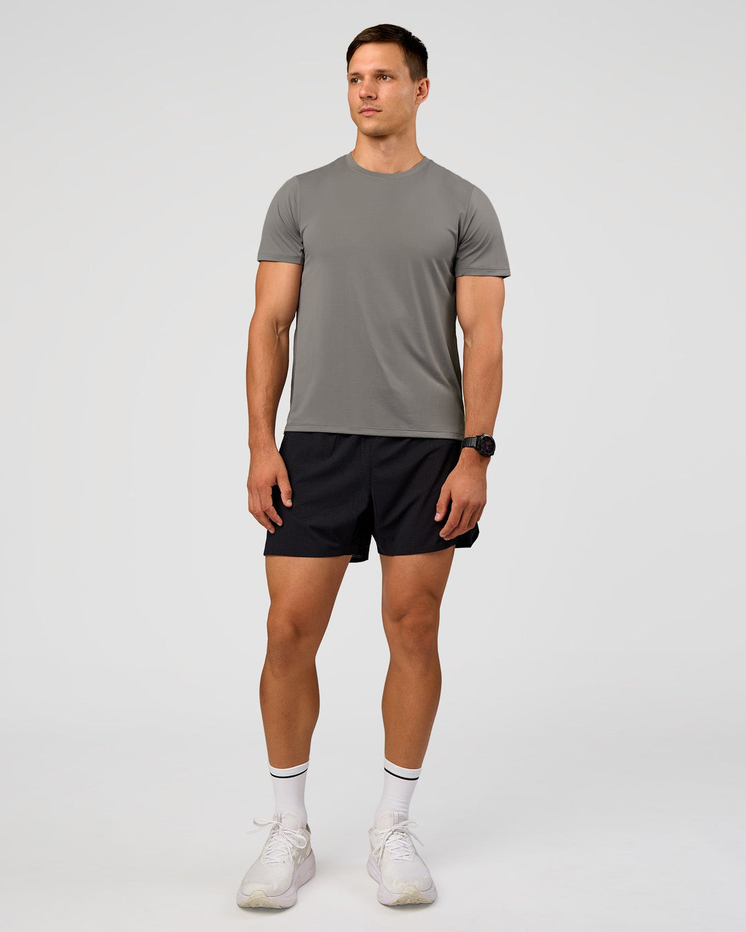 Man wearing UltraAir 5" Lined Performance Short  - Black-Reflective | Model:Liam | Size:L