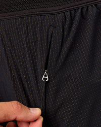 Man wearing UltraAir 5" Lined Performance Short  - Black-Reflective | Model:Liam | Size:L