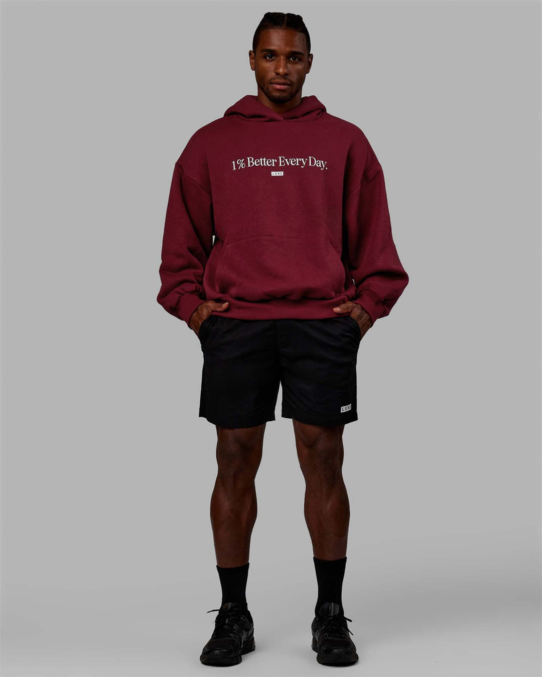 Man wearing Unisex 1% Better Hoodie Oversize - Cranberry-White