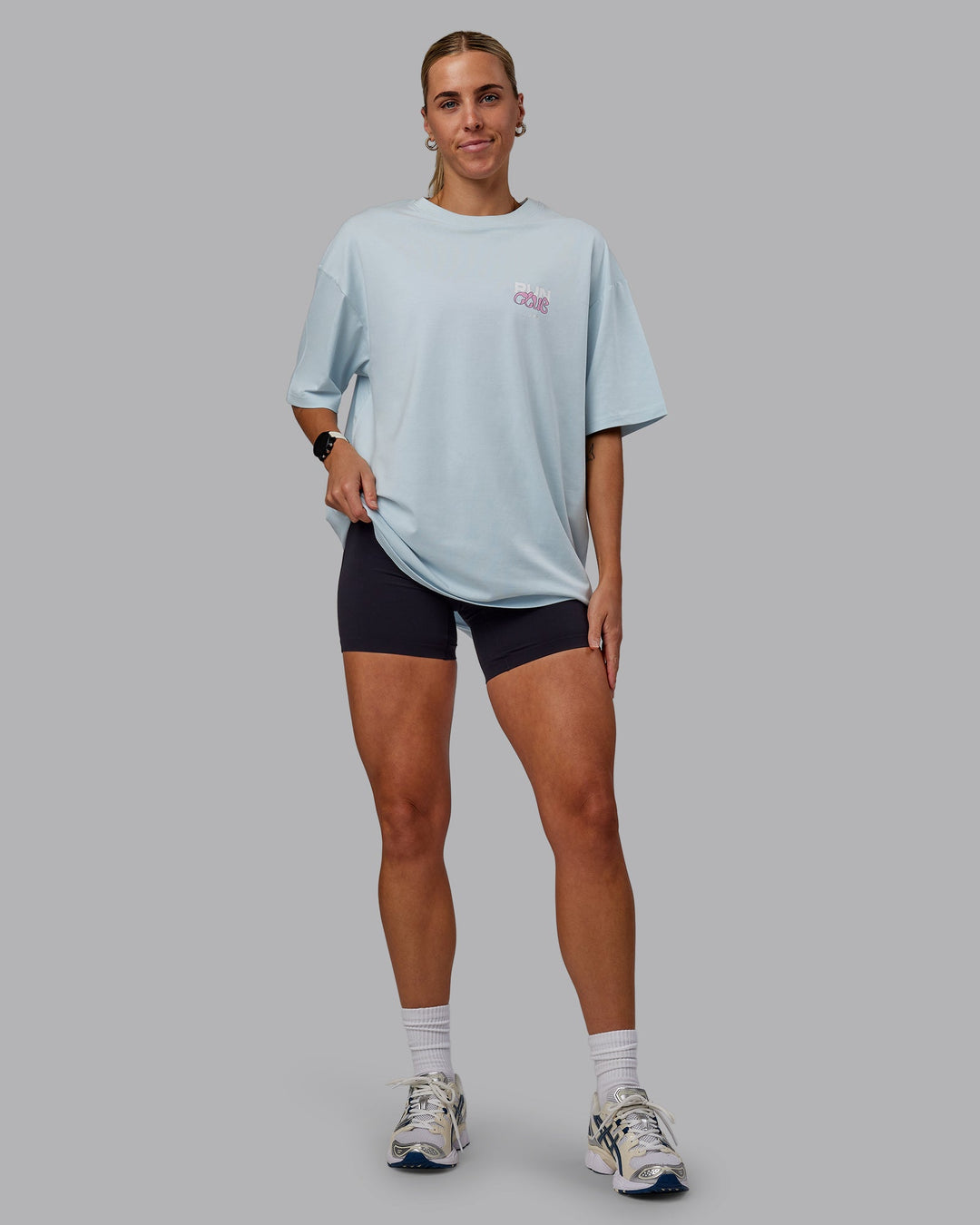 Woman wearing Unisex Gone Running FLXCotton Tee Oversize - Skyride-Bubblegum