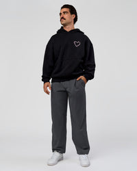 Man wearing Unisex Love The Process Oversize Hoodie - Black-Marshmallow | Model:Adam | Size:L