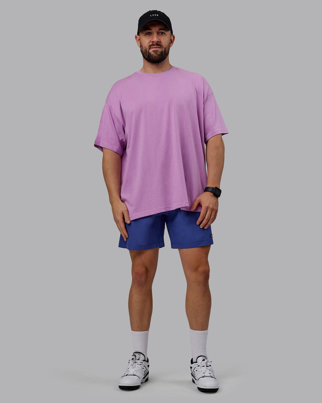 Man wearing Unisex Pressure Heavyweight Tee Oversize - Light Violet-White