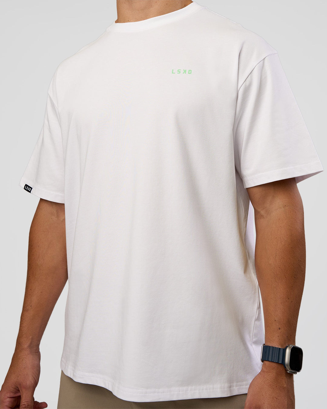 Man wearing Unisex Strike Through FLXCotton Tee Oversize - White-Warm Apricot | Model:Jaiden | Size:L