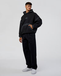 Man wearing Urban Blur Unisex Oversized Hoodie - Black-Dark Storm | Model:Jackson | Size:L