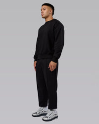 Man wearing Urban Cropped Track Pant - Black| Model:Kaelyb | Size:L