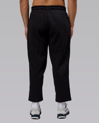 Man wearing Urban Cropped Track Pant - Black| Model:Kaelyb | Size:L