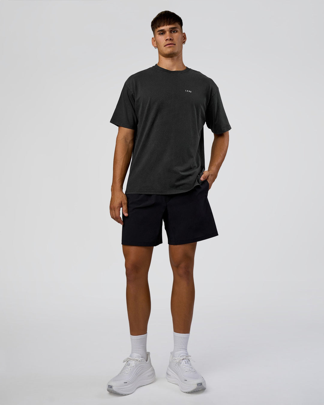 Man wearing We Love This  FLXCotton Oversized Tee - Black Washed-White | Model:Jackson | Size:L