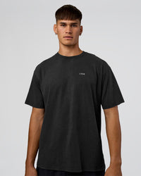 Man wearing We Love This  FLXCotton Oversized Tee - Black Washed-White | Model:Jackson | Size:L