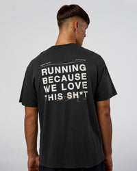 Man wearing We Love This  FLXCotton Oversized Tee - Black Washed-White | Model:Jackson | Size:L