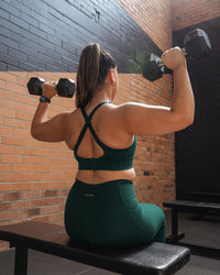 Woman wearing Accelerate Sports Bra - Dark Moss | Model:Gloria | Size:M