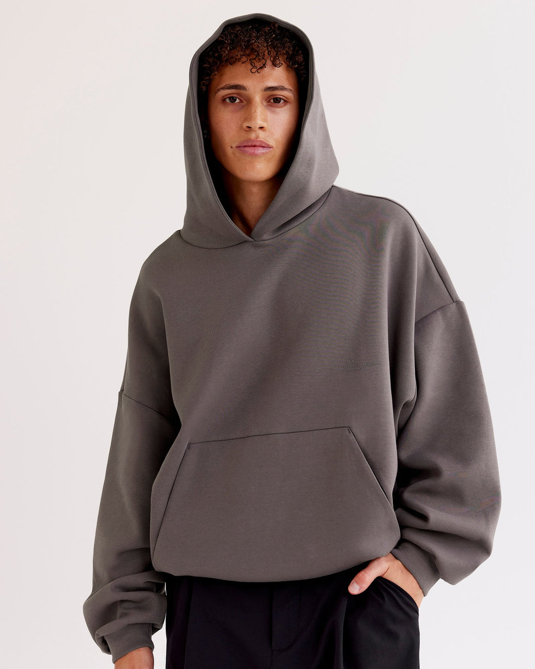 Man wearing AfterDark ZeroCrease Oversized Hoodie - Duskstone | Model:Leandro | Size:M