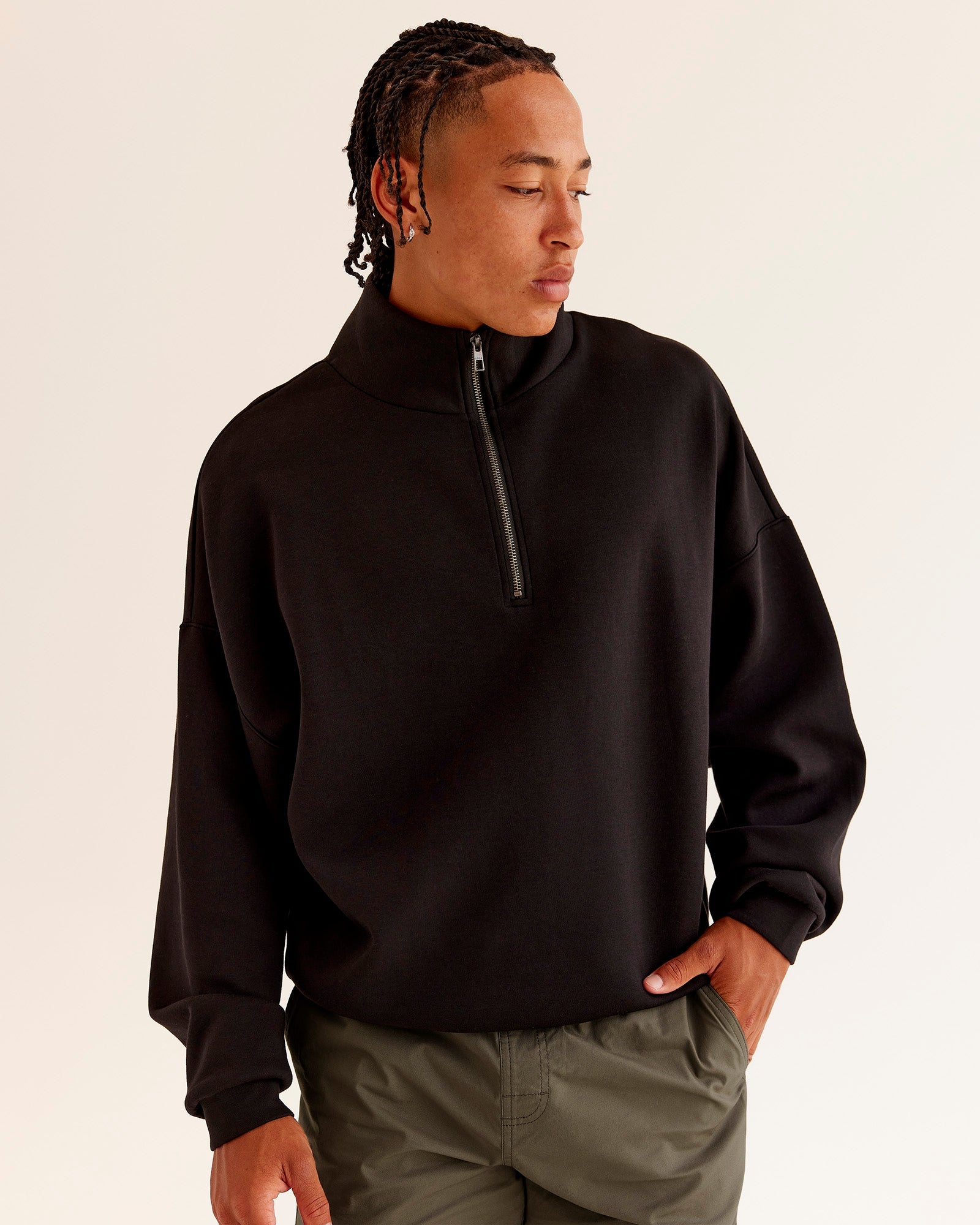 Man wearing AfterDark ZeroCrease Quarter Zip - Black | Model:Malebo | Size:M