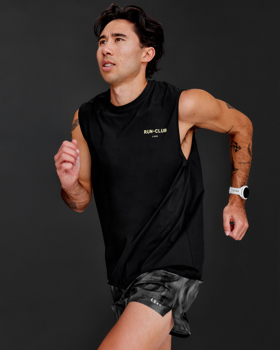Man wearing Cadence RUN CLUB Muscle Tank - Black-Yellow Fizz | Model:Jared | Size:M - view 2
