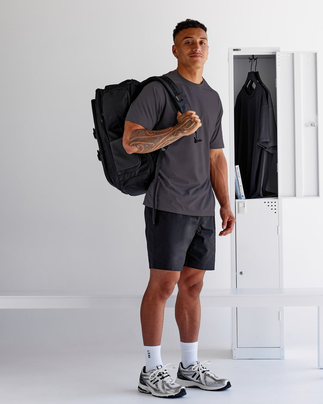 Man wearing Forever EffortlessTech Tee - Dark Storm | Model:Daarian | Size:M