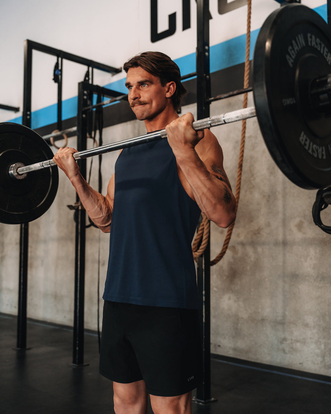 Man wearing AeroFLX+ Seamless Muscle Tank - Navy/Navy | Model: | Size:M