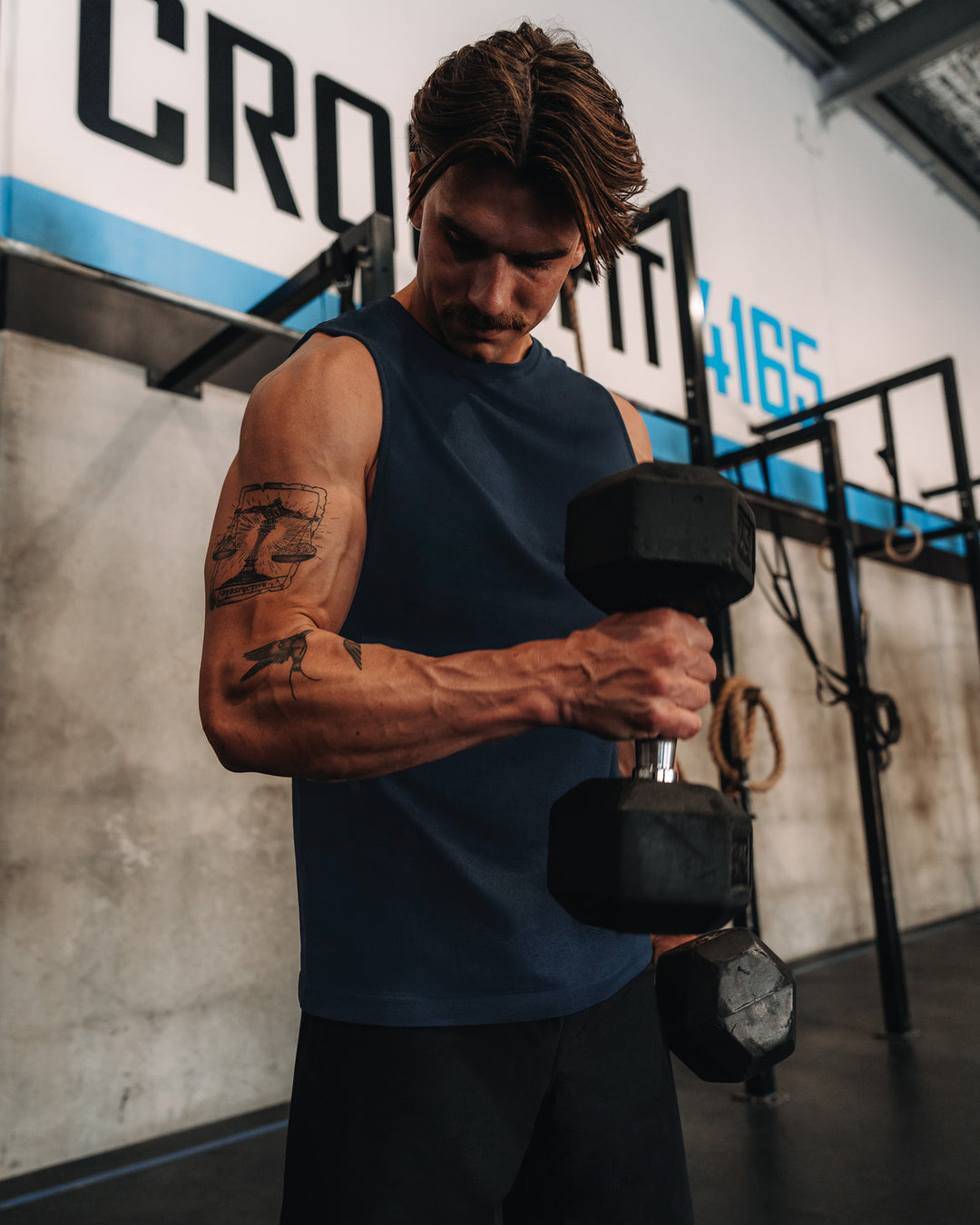 Man wearing AeroFLX+ Seamless Muscle Tank - Navy/Navy | Model: | Size:M