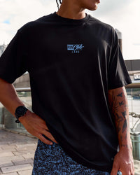 Man wearing Run Club Script FLXCotton Oversized Tee - Black-Palace Blue | Model:Malebo | Size:M