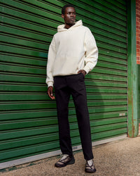Man wearing Shadow Mode Oversized Hoodie - Off White | Model:Mabyro | Size:M