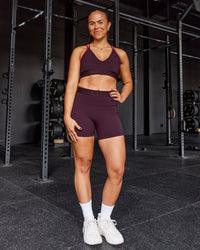 Woman wearing Strive Jacquard Sports Bra - Cherry Lacquer | Model:Tyra | Size:M