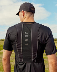 Woman wearing Pace Running Vest - Black-Reflective | Model:Jesse | Size:M/L