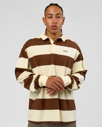 Man wearing Clubhouse Unisex Polo - Off White-Brown | Model:Malebo | Size:M