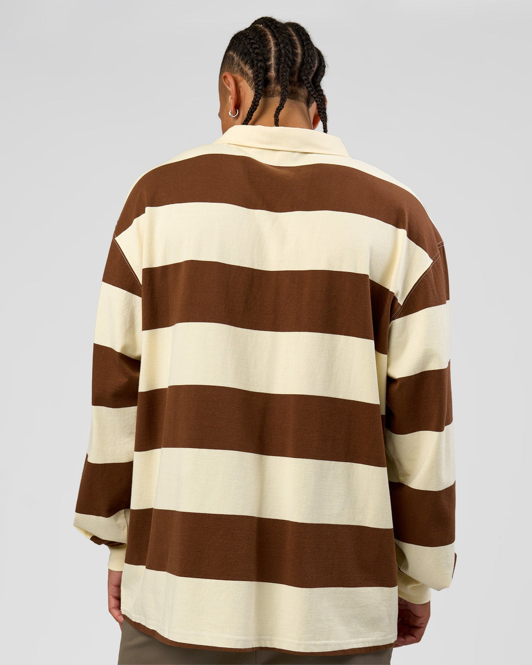 Man wearing Clubhouse Unisex Polo - Off White-Brown | Model:Malebo | Size:M