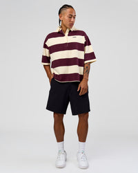 Man wearing Oversized Rugby Polo - Off White-Cherry | Model:Malebo | Size:M