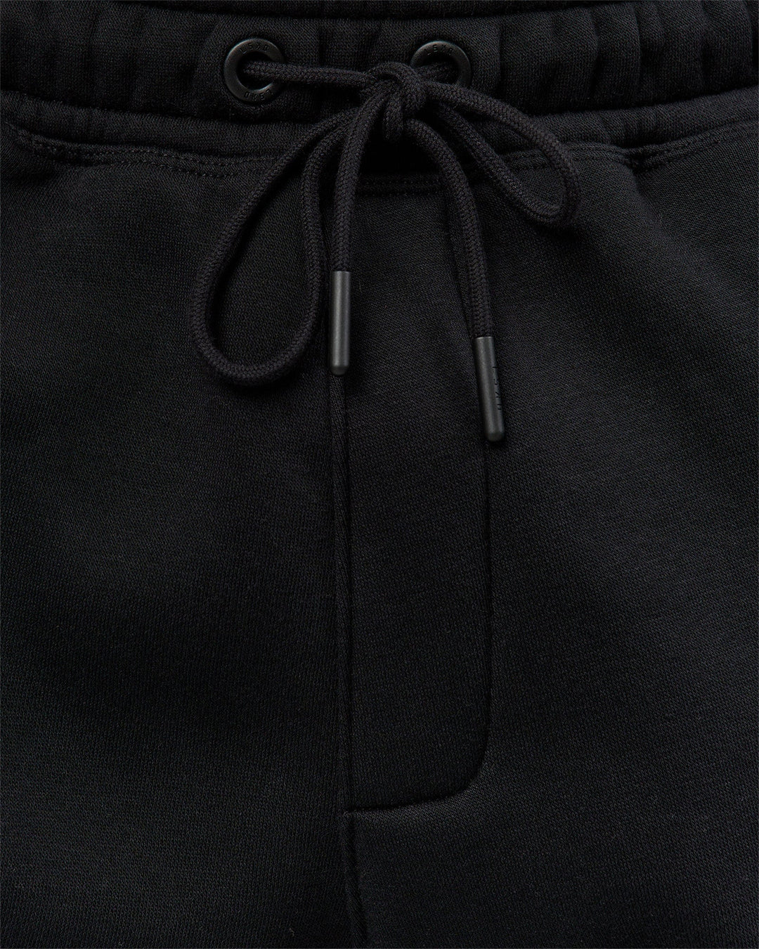 Man wearing Static Grit Baggy Track Pant - Black-Alloy | Model:Jaiden | Size:M