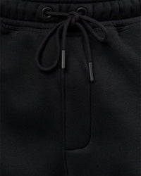 Man wearing Static Grit Baggy Track Pant - Black-Alloy | Model:Jaiden | Size:M