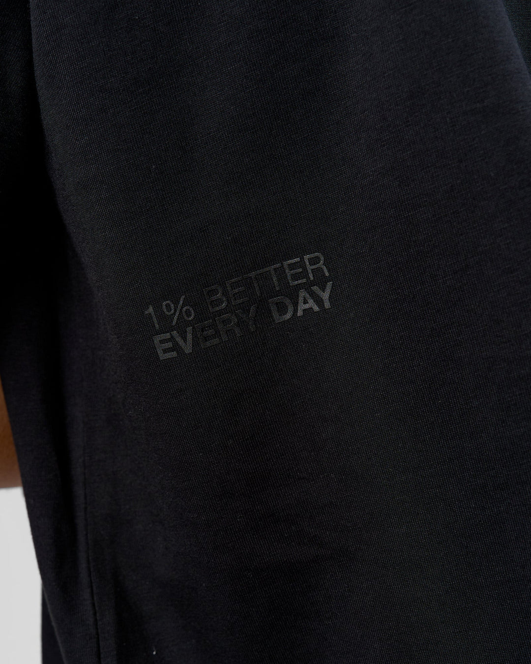 Man wearing 86 V-Neck Oversized Tee - Black-Black | Model:Leandro | Size:M