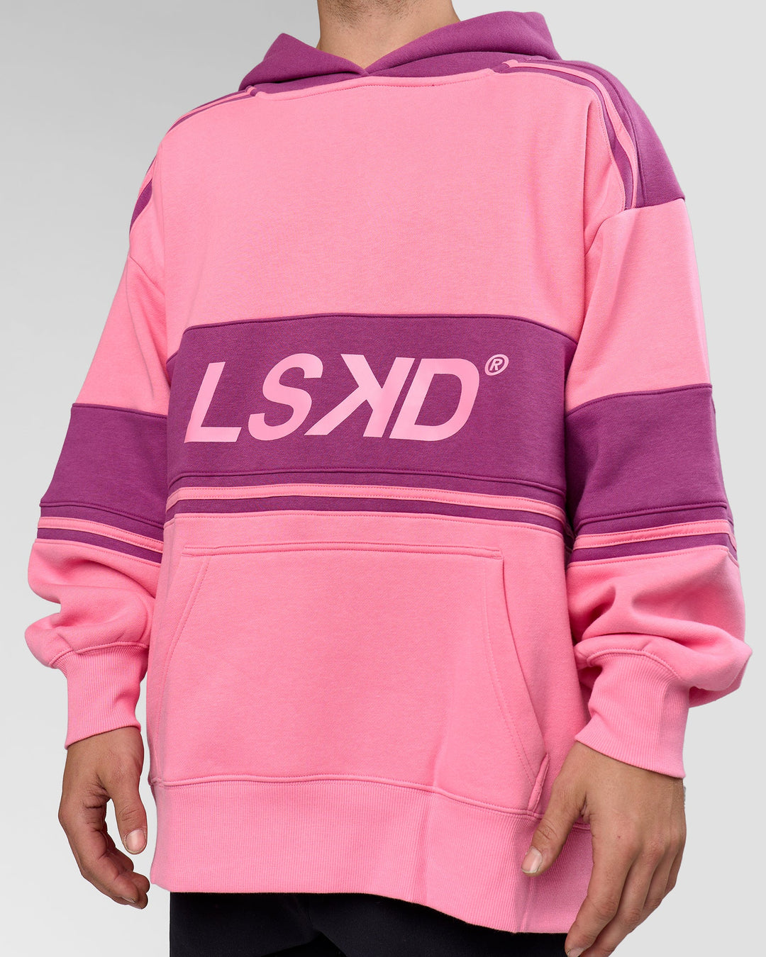 Man wearing A-Team Oversized Hoodie - Candy Pink-Boysenberry | Model:Arran | Size:M