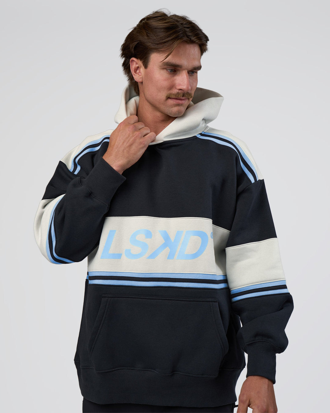 Man wearing A-Team Oversized Hoodie - Caviar-Open Air | Model:Konnor | Size:M