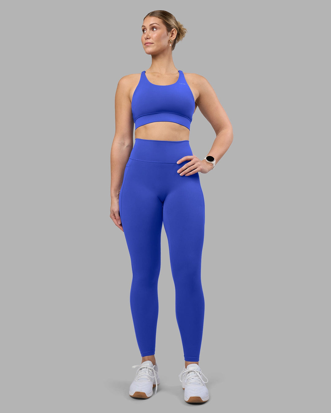 Woman wearing Accelerate Sports Bra - Power Cobalt | Model:Amy | Size:M