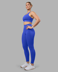 Woman wearing Accelerate Sports Bra - Power Cobalt | Model:Amy | Size:M