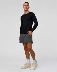 Man wearing AeroFLX+ Seamless Long Sleeve Tee (Set in Sleeve) in Black/Black | Model:Albert | Size:M