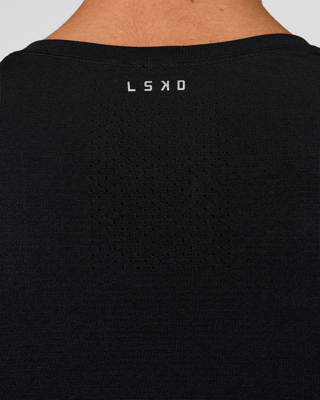 Man wearing AeroFLX+ Seamless Long Sleeve Tee (Set in Sleeve) in Black/Black | Model:Albert | Size:M