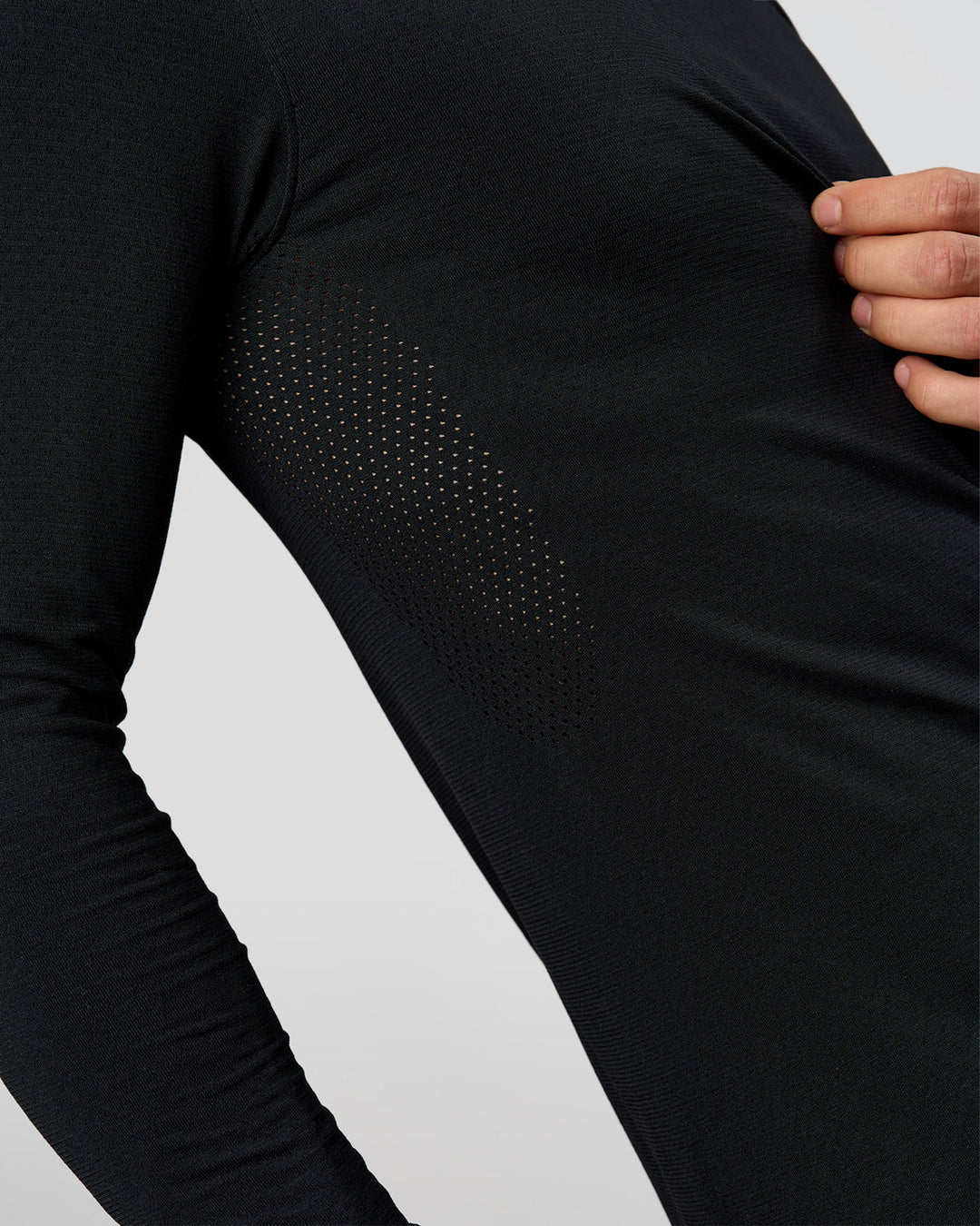 Man wearing AeroFLX+ Seamless Long Sleeve Tee (Set in Sleeve) in Black/Black | Model:Albert | Size:M