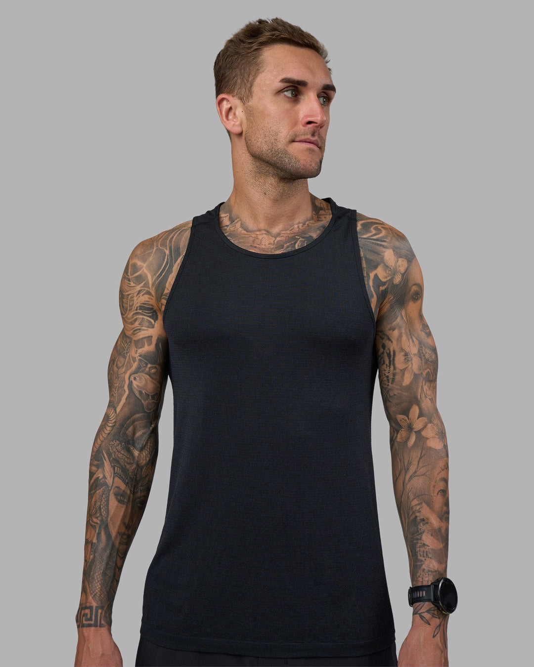 Man wearing AeroFLX+ Seamless Tank - Black Marl | Model:Tommy | Size:M