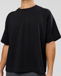 Man wearing AfterDark ZeroCrease Boxy Tee in Black | Model:Leandro | Size:M
