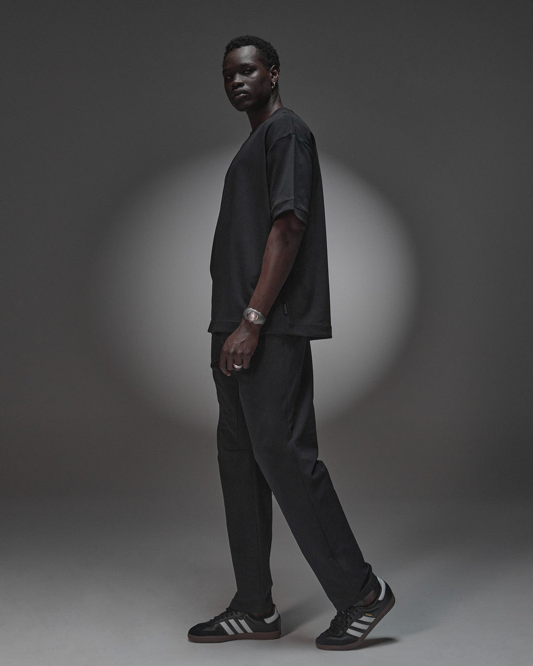 Man wearing AfterDark ZeroCrease Oversized Tee - Black | Model:Mabyro | Size:M