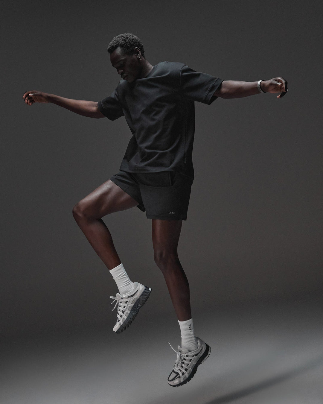 Man wearing AfterDark ZeroCrease Oversized Tee - Black | Model:Mabyro | Size:M