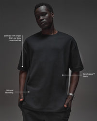 Man wearing AfterDark ZeroCrease Oversized Tee - Black | Model:Mabyro | Size:M