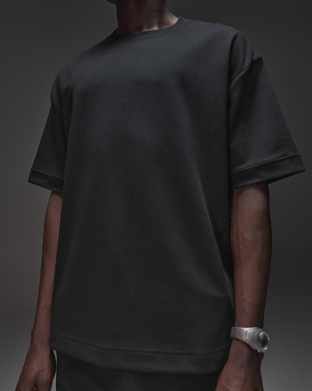 Man wearing AfterDark ZeroCrease Oversized Tee - Black | Model:Mabyro | Size:M