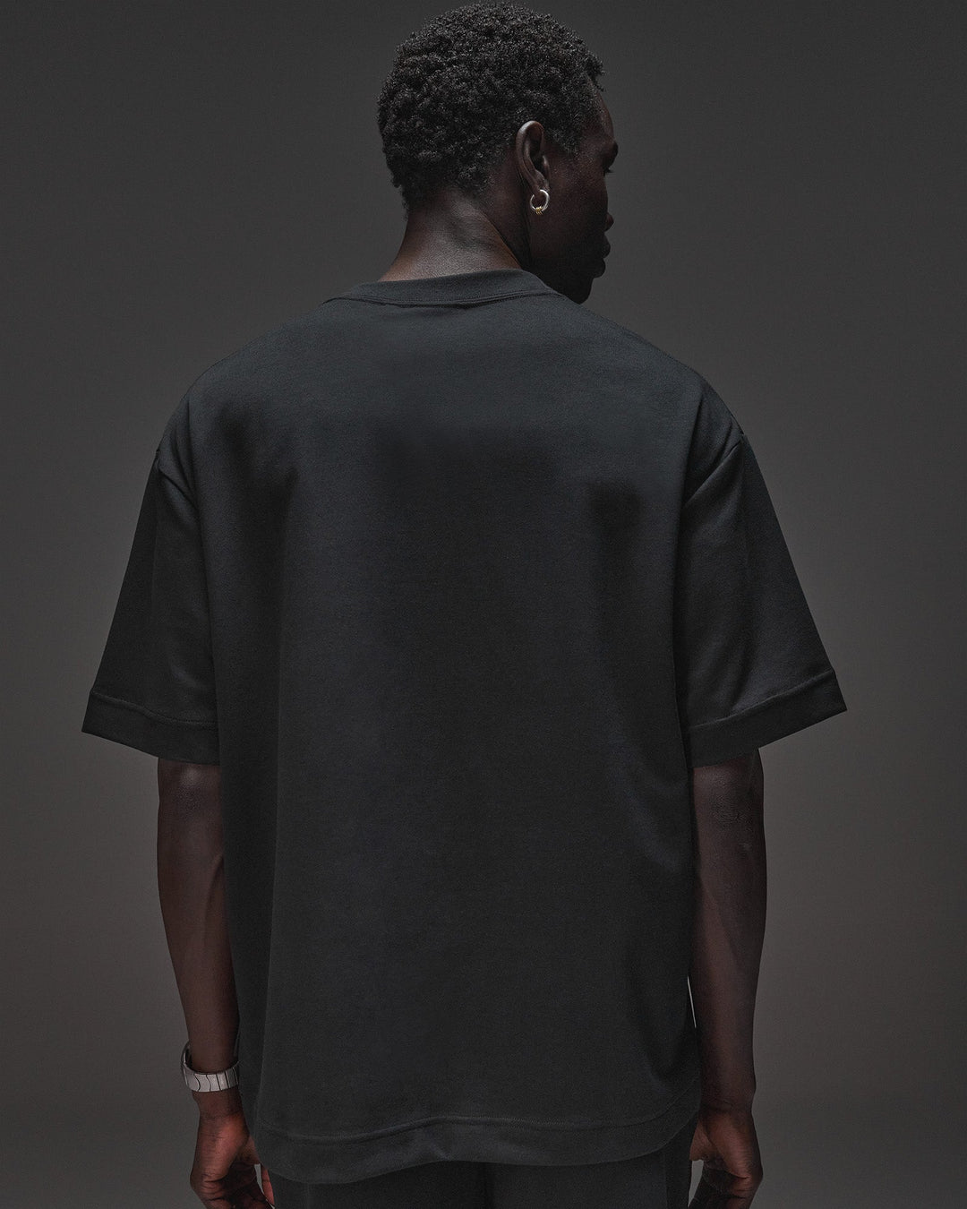 Man wearing AfterDark ZeroCrease Oversized Tee - Black | Model:Mabyro | Size:M