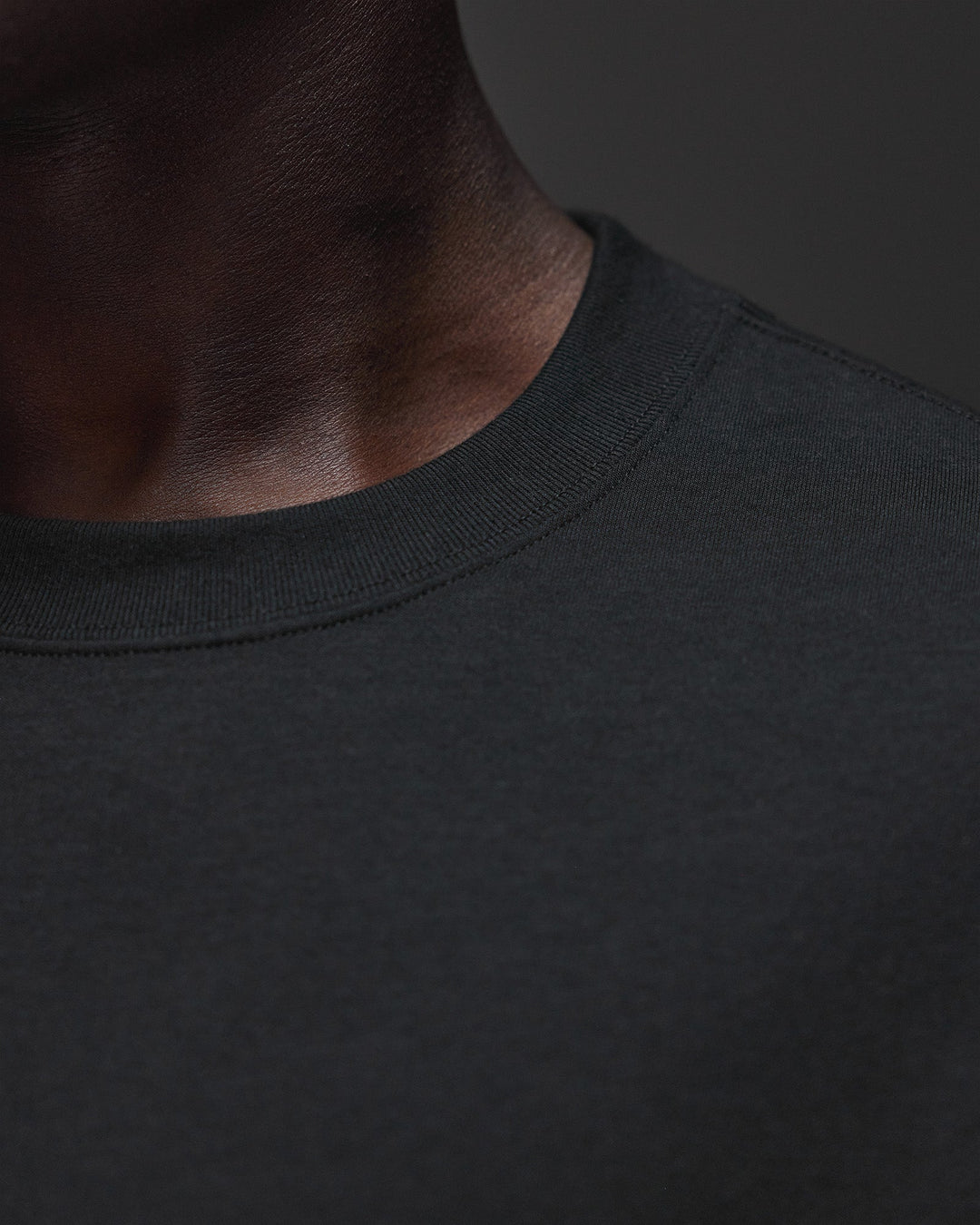 Man wearing AfterDark ZeroCrease Oversized Tee - Black | Model:Mabyro | Size:M