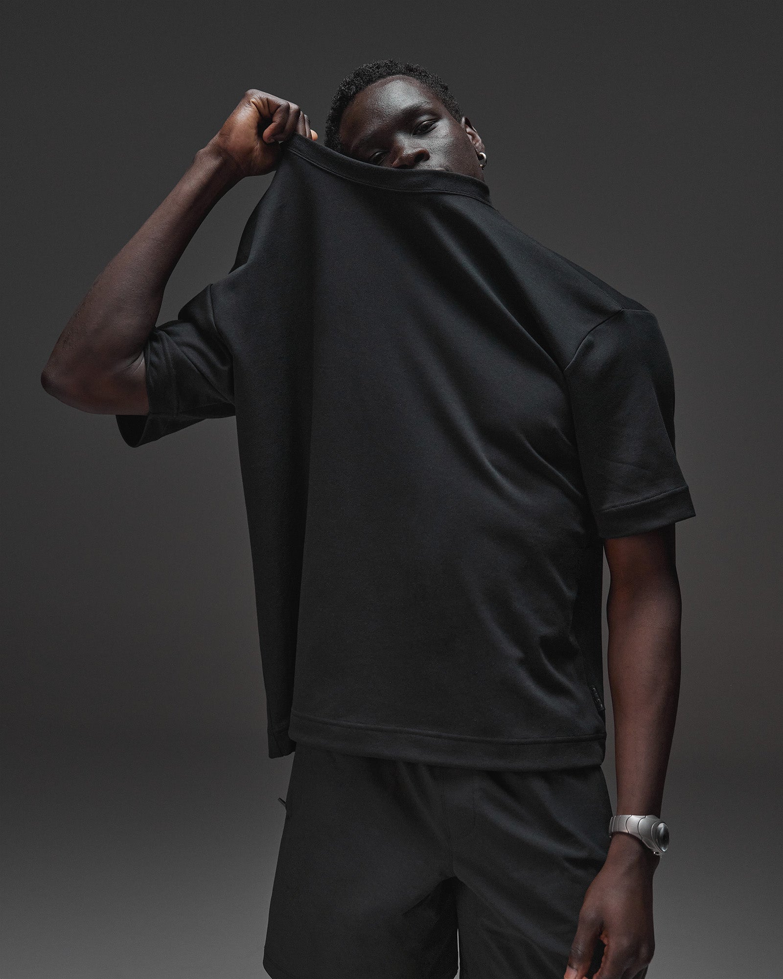 Man wearing AfterDark ZeroCrease Oversized Tee - Black | Model:Mabyro | Size:M