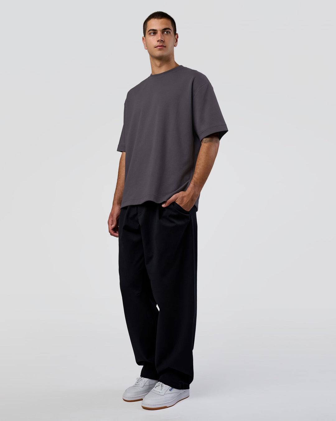 Man wearing AfterDark ZeroCrease Oversized Tee - Dark Storm | Model:Zoran | Size:M