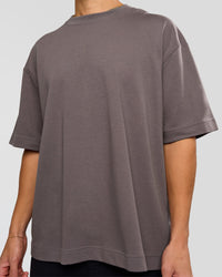 Man wearing AfterDark ZeroCrease Oversized Tee - Duskstone | Model:Leandro | Size:M
