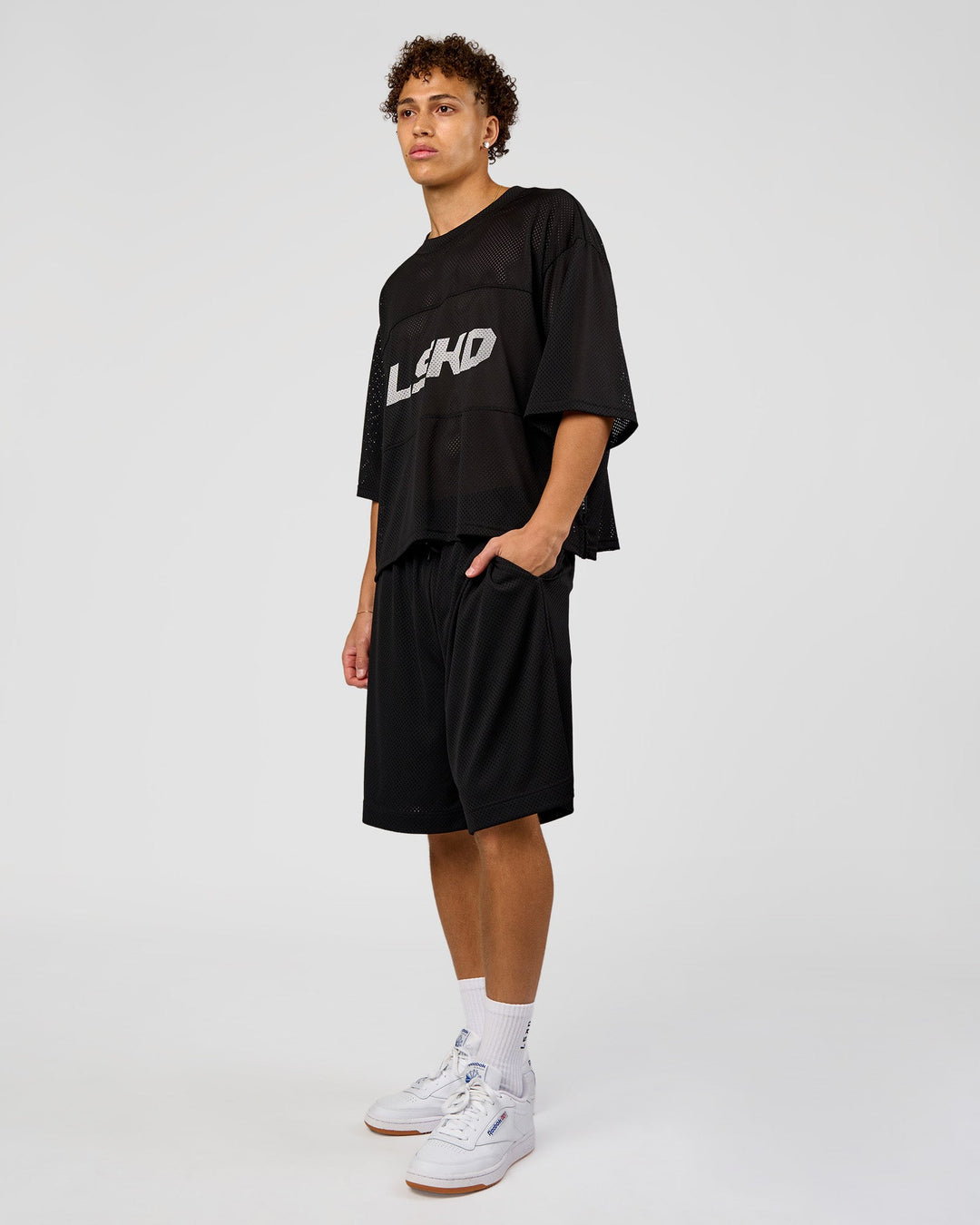 Man wearing AirCore Jersey - Black-Black | Model:Leandro | Size:M